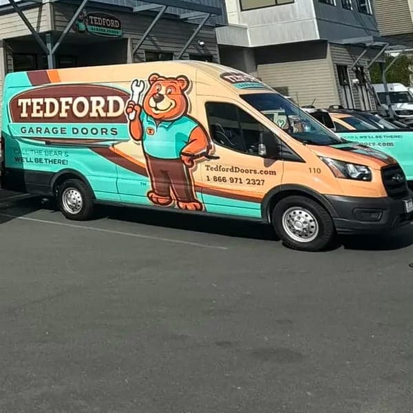A Tedford Garage Doors van with the bear mascot livery parked outside the Victoria shop