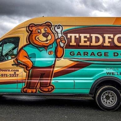 The Tedford bear mascot painted on the side of a Tedford service van
