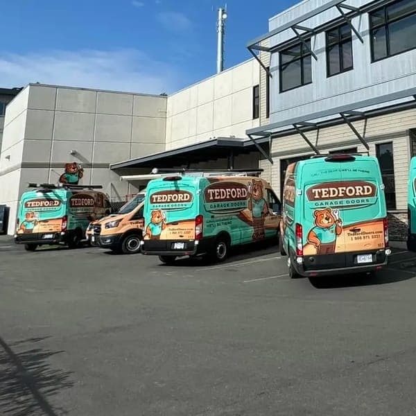 The Tedford Garage Doors Victoria shop with Tedford vans lined up out front